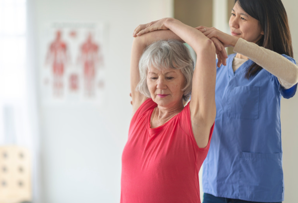 Occupational therapist helping a elderly woman